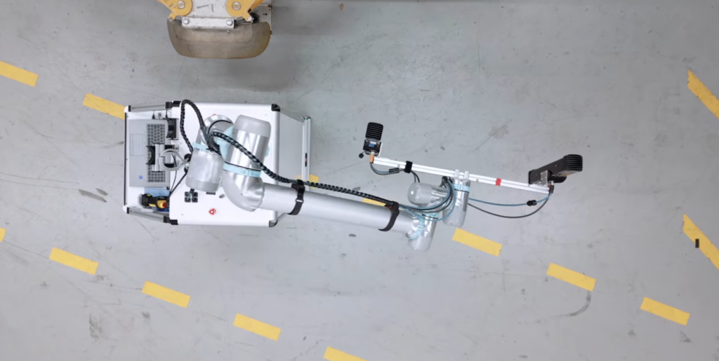 Autonomous Mobile Robot (AMR) powered by Photoneo 3D vision systems, scanning an inspected vehicle in motion and color. 